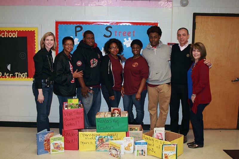 Pictured are Pine Street Principal, Kim Vier, Open Campus High School's Asst Principal/Interact Club Sponsor Jeanine Purvis, Deron Dudley-Bryant, Naijeema Chavous, Eliah Holmes, Devonte O'Neal, and from Rotary Club of Rockdale, Club President, Alain Bouzoubaa and Youth Services Director, Cheryl Cooper