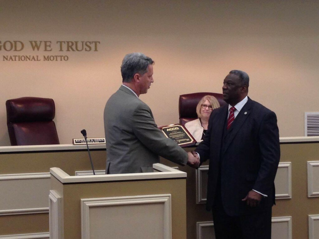 ACCG Executive Director Ross King presents to Chairman Oden at the April 28 Board of Commissioners meeting an award for his longstanding service of six years on the Economic Development and Transportation Policy Committee
