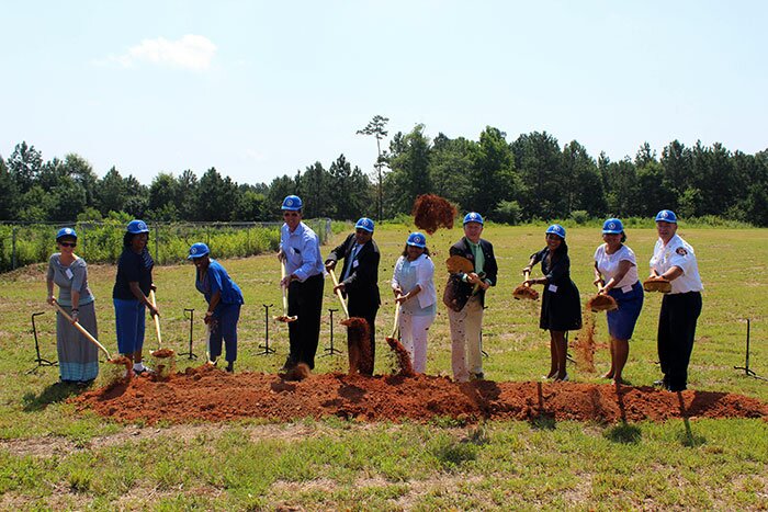 Approximately 70 people gathered today for a ground breaking ceremony for a Holiday Inn Express & Suites to be built in Covington, Ga. Pictured from left to right are: City Manager Leigh Anne Knight, Councilwoman Ocie Franklin, Councilwoman Janet Goodman, Mayor Ronnie Johnston, Royal Hotel Investment Chairman Navin Shah, Dr. Taru Shah, State Representative Dave Belton, Dr. Pali Shah, Dr. Shefali Shah, Fire Chief Stoney Bowles