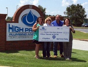 Left to Right: Katie Beam (Prevent Child Abuse Rockdale Community Outreach Coordinator), Diane Howington (Director of Prevent Child Abuse Rockdale), Brian Simpson & Paulette Simpson (Owners of High Priority Plumbing).