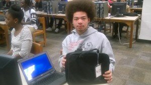 Salem student Winston Russell displays his new laptop 